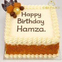 Egg-free Lotus Biscoff birthday cake with Biscoff biscuits, Ferrero Rocher chocolates, chocolate decorations, vanilla buttercream border and personalised birthday message.
