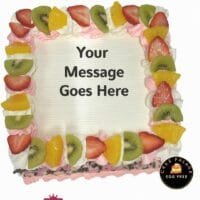 Egg-free fresh fruit fresh cream cake topped with strawberries, kiwi, pineapple, and personalised message
