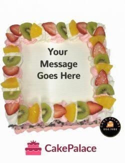 Egg-free fresh fruit fresh cream cake topped with strawberries, kiwi, pineapple, and personalised message