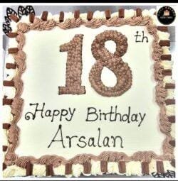18th birthday egg-free fresh cream cake with chocolate piping, chocolate finger bars, decorative chocolate leaves, and personalised message