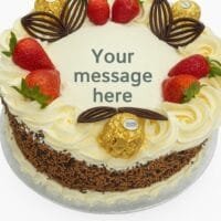 Signature Ferrero Strawberry Delight egg free fresh cream decorated with mix sprinkles on side, ferrero ,strawberry and chocolate fans on top birthday cake