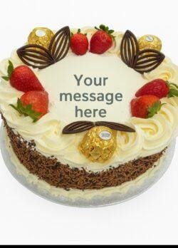 Signature Ferrero Strawberry Delight egg free fresh cream decorated with mix sprinkles on side, ferrero ,strawberry and chocolate fans on top birthday cake