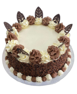 Round white and chocolate leaves cake