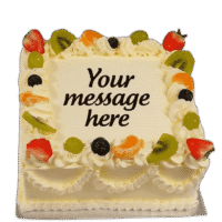 Egg Free Fresh Fruit Celebration Cake decorated with strawberries, kiwi, grapes, mandarin segments, blueberries and a personalised message.