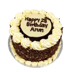 Egg Free Black Forest Celebration Cake decorated with chocolate curls, cream swirls and a personalised chocolate message plaque.