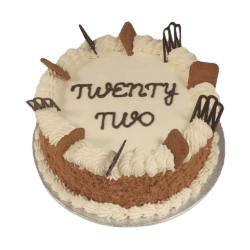Egg Free Biscoff Celebration Cake decorated with Lotus Biscoff biscuits, Biscoff crumb coating, decorative chocolate pieces and a personalised message.
