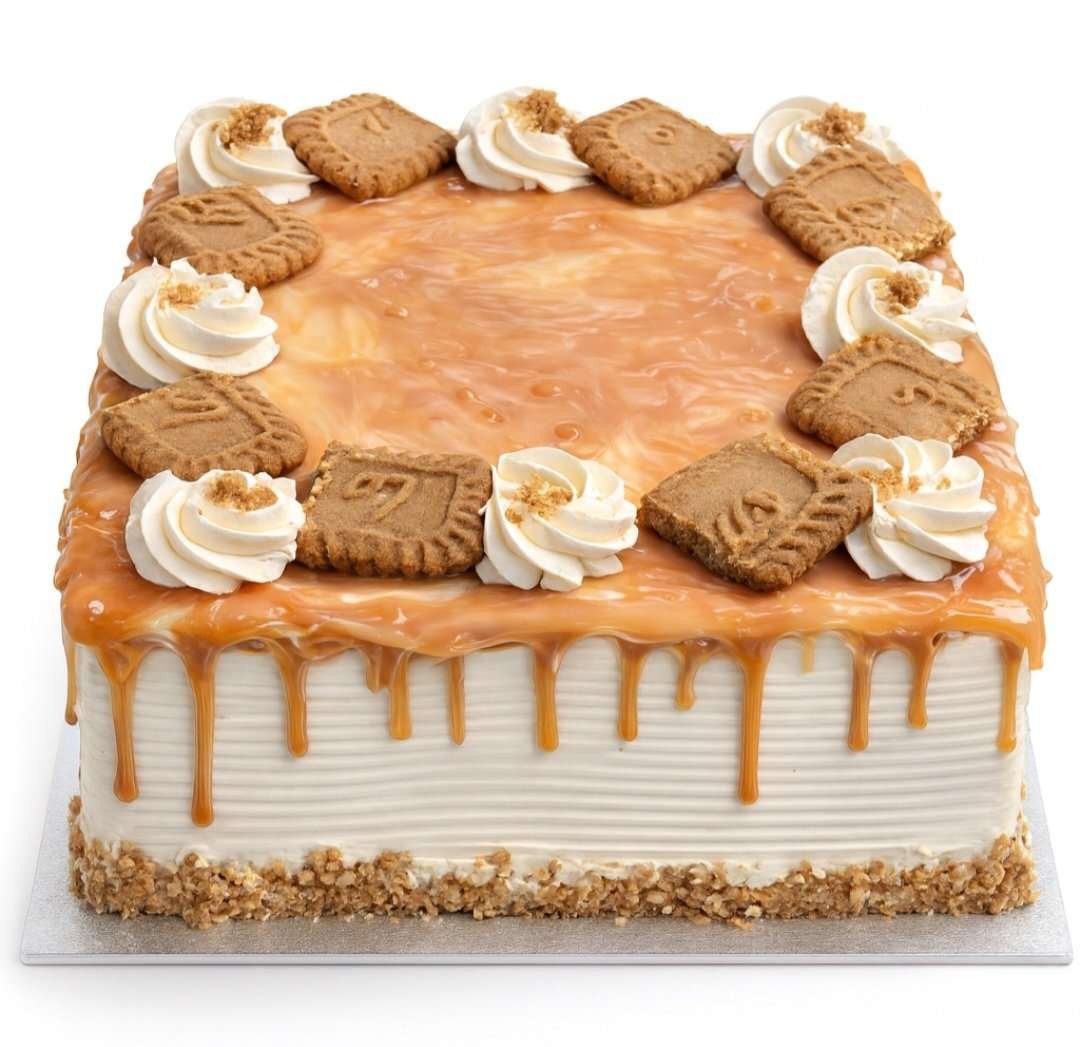 Caramel Drip Fresh Cream Cake Square fresh cream caramel cake with a rich caramel drip, caramel glaze, fresh cream swirls, and biscuit pieces on top.