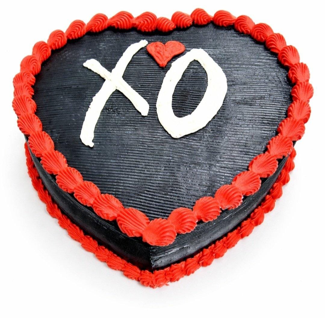 XO Heart Fresh Cream Cake Front Top view of a heart-shaped black fresh cream cake with red borders and a personalised XO design.
