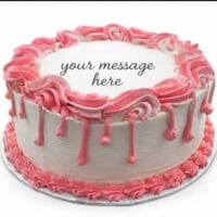 Round white fresh cream birthday cake with pink drip decoration, pink piped borders, textured sides, and a personalised message.