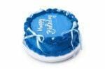 Round blue fresh cream birthday cake with white ribbon bows, shell borders, pearl decorations, and a custom birthday message.