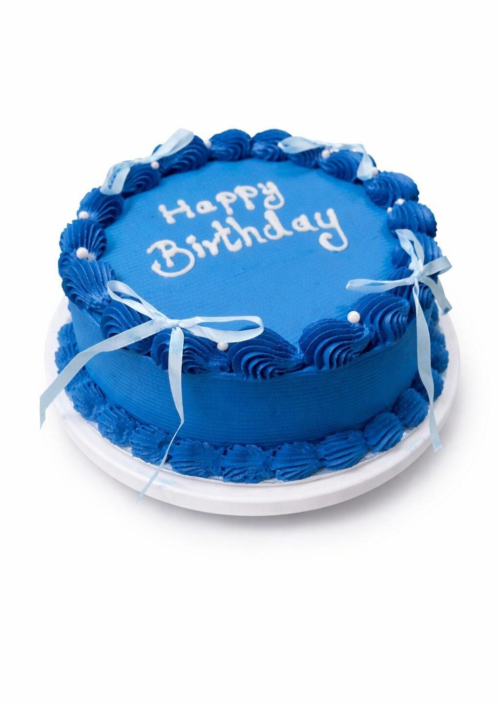 Blue Ribbon Fresh Cream Birthday Cake Top Top view of a royal blue fresh cream birthday cake featuring shell borders, white ribbon bows, pearl accents, and custom birthday writing.