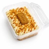 Lotus rosettes with biscuit halves. Cookie crumble border. Double Lotus sauce. Premium gold pearl finish.