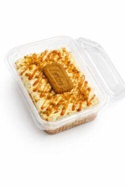 Lotus rosettes with biscuit halves. Cookie crumble border. Double Lotus sauce. Premium gold pearl finish.