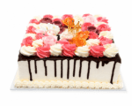 Luxury Floral Chocolate Drip Celebration Cake decorated with smooth vanilla buttercream, rich chocolate drip, pink and white buttercream swirls, handcrafted sugar flowers, and a gold crown topper. Freshly made in Sheffield.