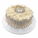 Elegant Ivory Crown Wedding Cake with ivory fresh cream rosettes, silver crown topper, egg-free vanilla or chocolate sponge from Cake Palace.