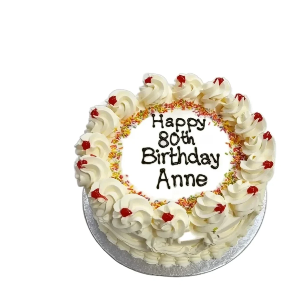Round egg-free birthday cake with fresh cream decoration, sprinkles, cherries and a personalised birthday message from Cake Palace Sheffield.