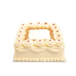 Square fresh cream celebration cake with smooth piped cream icing, rainbow sprinkles border, classic jam dots, decorative cream swirls, and space for a personalised birthday or celebration message, handmade by Cake Palace UK.