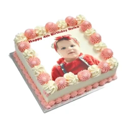 Personalised square birthday cake with a custom edible photo printed on top, finished with pink and white piped swirls around the border, smooth white icing finish, and matching pink piped base trim. Ideal for birthdays, children's parties, anniversaries, baby celebrations, and personalised cake gifts.