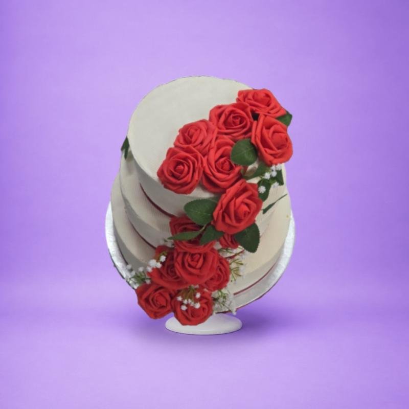Elegant Three Tier Rose Wedding Cake Luxury Egg Free wedding cake featuring three tiers with handcrafted red rose cascade decoration.